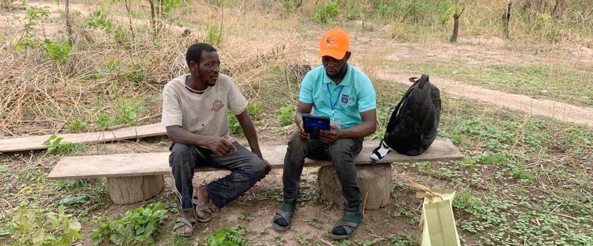 Enumerator for the JobAgri project interviewing a farmer © Hayford Opoku